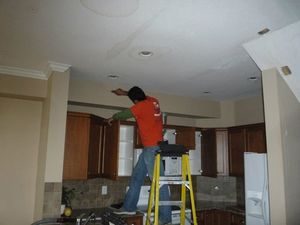 Water damage Holt Technicians repairing ceiling