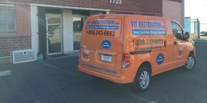 Water Damage and Mold Removal Vehicle At Job Site